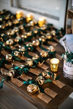 a table topped with lots of gold and green decorations