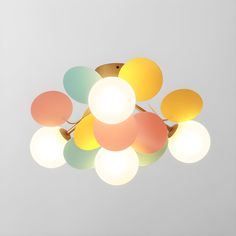 a multicolored light fixture hanging from the ceiling