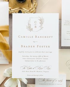 the wedding stationery is laid out on top of each other