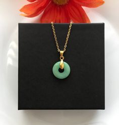 **An Elegant Jade Necklace: Jade is a stone that brings good luck, friendship, peace, and harmony** ** 18mm Light Donut Jade Gemstones ** **16 or 18 inches chain Gold Stainless Steel** Green Round Disc Necklace For Gift, Jade Pendant Necklace, Donut Shape, Jade Gemstone, Jade Necklace, Gem Stones, Chain Gold, Jade Pendant, Pretty Jewellery