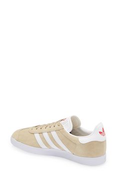 Initially designed as a training shoe for top athletes in 1991, adidas' iconic Gazelle sneaker has been refreshed with a sleek, narrower silhouette but retains the classic contrasting 3-Stripes and heel tab of the original, and is presented in throwback archival hues. Style Name:Adidas Gazelle Sneaker. Style Number: 5157452. Available in stores. Adidas Retro Sneakers For Skateboarding, Adidas Retro Skateboarding Sneakers, Retro Adidas Sneakers For Skateboarding, Adidas Retro Skate Shoes With Rubber Sole, Retro Adidas Skate Shoes With Rubber Sole, Adidas Retro Sneakers With Gum Sole, Adidas Retro Skate Shoes For Skateboarding, Retro Adidas Sneakers With Gum Sole, Retro Adidas Skate Shoes For Skateboarding