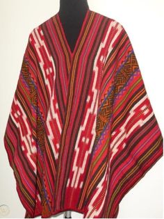 "This poncho is hand woven in the traditional Andean method \"Aguayo\" This poncho will fit people size ranging medium to large. AGUAYO: Is a naturally dyed blend of alpaca, llama and sheep wool , hand woven in the Andean village of Peru called Paucartambo by the Q'eros community. Culture: Quechua Material: Alpaca blend Measurements: 68 X 48 inches (172cm x 122cm)" Luxury Multicolor Poncho, Traditional One Size Woven Poncho, Handwoven Festival Poncho Shawl, Traditional Handwoven One-size Poncho, Traditional Woven Shawl Poncho, Traditional Handwoven Poncho One Size, Handwoven Poncho Shawl For Festivals, Handwoven Folk Shawl One Size, Folk Style Handwoven Shawl