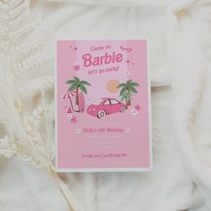 a pink car birthday party card with palm trees on the side and an umbrella in the background