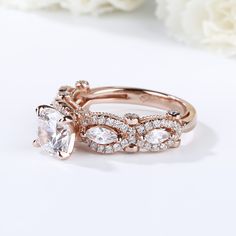 She is the type of person that makes forever seems too short. Treat beloved her to this stunning ring that celebrates your endless love and passion. This design features a shimmering round cut stone at the center, while marquise cut stones and additional round stones decorate the twisting shank. With rose gold color and milgrain on the shank,this ring shows a really elegant and exquisite on her finger. Carat Weight: 2.5 ctStone Size: 7 mmStone Type: Jeulia® StoneNumber of Stones: 1 Stone Color: Diamond WhiteStone Shape: RoundCarat Weight: 0.933 ctStone Size: 1.1,1.5,2,3*1.5 mmStone Type: Jeulia® StoneNumber of Stones: 63 Stone Color: Diamond WhiteStone Shape: Round, MarquiseWeight: 5.1 gWidth: 6.44 mmHeight: 8.32 mmThickness: 2.46 mmMaterial: 925 SilverPlating Color: Rose Gold Diamond White Marquise Cut Stackable Rings For Anniversary, Marquise Cubic Zirconia Stackable Rings For Anniversary, Elegant Bridal Sets With Halo Setting For Promise, Elegant Bridal Sets With Halo Setting, Elegant Rose Gold Bridal Sets For Anniversary, Marquise Diamond Crystal Ring For Anniversary, Dazzling Marquise Diamond Promise Ring, Marquise Cut Cubic Zirconia Stackable Wedding Rings, Elegant Marquise Promise Ring