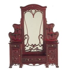 an ornate wooden vanity with mirror and drawers