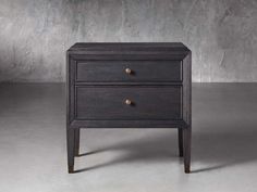 a black wooden table with two drawers on one side and gold knobs on the other