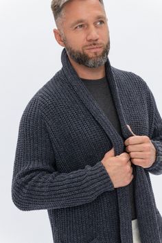 "Classic gray color cardigan is ideal Christmas gift for him! Stylish & cozy cardigan features two front pockets and minimalist Wool House label. Slow fashion delivers the best quality woolen cardigan which made of 100% pure new wool. Inspired by Scandinavian style. Model in the photo is wearing size L. Model's height is 180 cm / 5.9 ft. *SIZE XS USA-CAN 30-32 EU 40-42 Garment's width 17.5-18 inch / 44-46 cm Garment's length 23.5-24 inch / 59-61 cm *SIZE S USA-CAN 34-36 EU 44-46 Garment's wi Classic Merino Wool Cardigan With Shawl Collar, Classic Knitted Merino Wool Cardigan, Woolen Cardigan, Cardigan For Men, Handmade Cardigan, Woolen Clothes, Christmas Gift For Him, Woolen Sweaters, Dark Gray Color