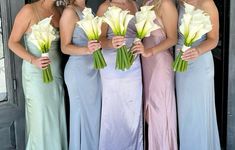 the bridesmaids are all wearing different colored dresses