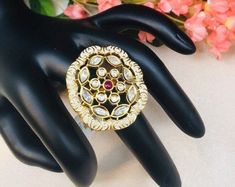 "Ivory Meenakari Kundan Ring/Meenakari Kundan/Statement Ring/Meenakari Jadau Ring/Wedding Jewelry/Pakistani Ring/Indian Wedding Ring Features: 1-Made in Brass 2-Adjustable Ring 3-Available in Gold finish 4- Made with very high quality Kundan Stones 5- Lightweight Jewelry 6- Suitable for any traditional or contemporary occasion 7- Width: 1.5\" 8- Ivory Meenakari Facebook: www.facebook.com/shoparyafashions Pinterest: www.pinterest.com/aryafashions Instagram: www.instagram.com/shoparyafashions Twit White Stone Work Wedding Gift, White Ceremonial Ring Jewelry, Traditional Wedding Rings With Stone Work, Traditional Kundan Rings With Hand Set, Kundan Rings For Wedding And Festivals, Traditional Silver Meenakari Rings, Meenakari Toe Ring For Wedding, Meenakari Rings For Wedding And Festivals, Meenakari Wedding Ring For Festivals