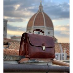 The Duomo in Florence was built over 700 years ago - we can't guarantee that this bag will last that long but we can guarantee that it was built to last your lifetime. This rock solid briefcase is made with full grain calfskin leather and is reinforced with microfiber board and padding to give it strength while at the same time making it lightweight. The extra-large size can carry loads of stuff between the 8 storage pockets and double gusset compartments. The thick full grain leather was hand t Classic Rectangular Cases With Leather Lining, Timeless Leather Rectangular Case, Timeless Rectangular Travel Briefcase, Classic Leather Satchel Case, Leather Rectangular Satchel For Business Meetings, Classic Satchel For Business Trips With Top Carry Handle, Timeless Satchel For Business Trips With Top Carry Handle, Classic Briefcase With Top Carry Handle And Rectangular Case, Timeless Rectangular Briefcase With Top Carry Handle