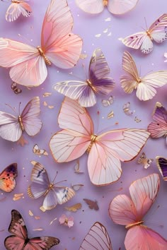 many pink and gold butterflies on a purple background