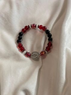 A red bracelet with a Guadalupe charm. Latina Bracelets, Mexican Bracelets, Red Bracelet, Red Bracelets, Jewelry Bracelets, Beaded Bracelets, Bracelet, Red, Jewellery Bracelets