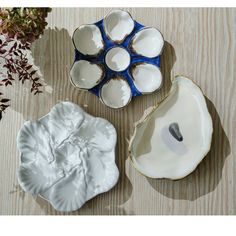 three bowls with different shapes and sizes on a table