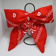 a red bow with white letters on it