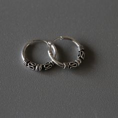 Delicate minimal sterling silver jewelry. Our products are made with 925 sterling silver and are hypoallergenic and nickel free! This listing is for a PAIR of hoops.  ✨ Hoop dimensions 12mm outer diameter, 10mm inner diameter  1.2mm thickness ✨ Material 925 sterling silver  🎁 Every order comes in a cute jewelry box ready to gift.🇹🇭 We ship from Bangkok, Thailand. 🤩 Flat shipping rate, add more products and shipping cost stays the same! 🌎 All orders ship with a tracking number. 😍 USA orders Everyday Silver Oxidized Hoop Earrings, Silver Sterling Hoop Earrings With Simple Design, Minimalist Silver Hoop Earrings With Oxidized Finish, Sterling Silver Hoop Earrings Stamped 925 For Everyday, Everyday Sterling Silver 925 Stamped Hoop Earrings, Everyday Sterling Silver Hoop Earrings Stamped 925, Cute Gift Boxes, Sterling Silver Hoops, Jewelry Earrings Hoops