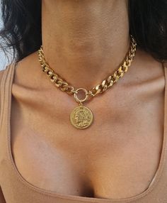 ♦ A Coin Necklace made of a Curb chain decorated with an O Ring in the center, The necklace is made of     Brass-plated gold in High quality.    I designed the necklace, Ofira Bezalel and it is an exclusive and unique design of Bezaldesignshop ▪  SIZA: 13.8IN (35 cm) up to 19.8IN (50cm) Besides the length of the chain, there is also an additional     Extension of 2.37IN (6 cm)    Width chain 0.39 inch (1cm)    Width coin:  1.18IN (3cm)    Thick chain: 0.08IN (2mm) ▪  Chunky Gold Chain Necklace w Coin Chain Necklace, Gold Chunky Necklace, Chunky Gold Chain Necklace, Gold Link Necklace, Chunky Gold Chain, Thick Chain Necklace, Gold Coin Necklace, Ring Der O, Medallion Necklace