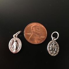 Beautiful Our B.V. Mary Medal : Miraculous Medals Set of 2x nice and detailed medals - Tiny medals to hang to your favorite rosary. Very beautiful. Size is small : 0.5" Made of silvered metal alloy. This amazing auction is for 2 Miraculous Medals, also known as the Medal of the Immaculate Conception: This is a medal originated by Saint Catherine Laboure' following her reported vision of the Blessed Virgin Mary. The Roman Catholic Church holds that wearing the medal with faith and devotion can br Catherine Laboure, Saint Peter Square, Saint Catherine, Blessed Mary, The Immaculate Conception, The Blessed Virgin Mary, Tiny Pendant, Immaculate Conception, Blessed Mother Mary