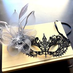 The black lace mask is accentuated by the decoration of gray floral highlighting its individuality. Black Masquerade Mask Women, Black Lace Mask, Mascarade Party, Masquerade Mask Women, Black Masquerade, Black Masquerade Mask, Mask Ball, Lace Masquerade Masks, Ball Mask