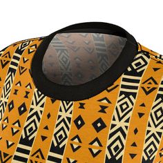 Unleash your creative spirit with our Saharan Geometric Elegance Tee, a classic yet contemporary piece that transforms traditional African mud cloth patterns into wearable art. This high-quality all-over print (AOP) t-shirt captures the intricate geometric designs and earthy ambiance of the Sahara, bringing a piece of heritage to your everyday wardrobe.Crafted from 100% polyester, this light fabric tee offers a comfortable, regular fit without compromising on durability. The tagless feature ensu Traditional Black Crew Neck Top, Traditional Printed Yellow Tops, Traditional Printed Black Tops, Traditional Black Printed Top, Traditional Fitted Crew Neck Top, Traditional Batik Print Festival Tops, Traditional Batik Print Tops For Festival, Traditional Crew Neck Top For Festivals, Traditional Brown Printed Top