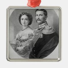 an old photo of a man and woman ornament with a red heart on top