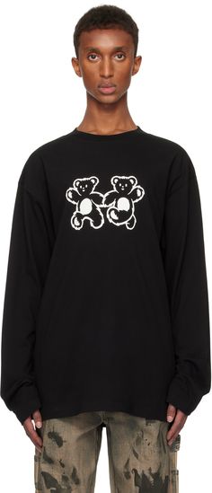 Cotton jersey T-shirt. · Rib-knit crewneck · Graphic printed at front and back · Dropped shoulders · Embroidered logo at back hem Supplier color: Black Black Long Sleeve T-shirt With Embroidered Graphics, Black Crew Neck Top With Embroidered Logo, Twins Logo, Crewneck Graphic, Knit Crewneck, Jersey T Shirt, Apparel Accessories, Rib Knit, Shirts Tops