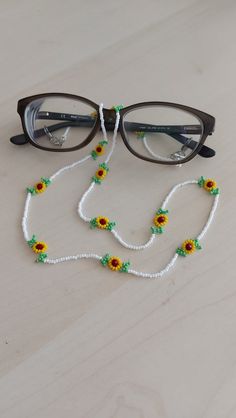 "You can always wear it easily. You can use it not only as eyeglass chain, but also as a necklace and bracelet Measures approx. 29\" (73 cm) total length Sunflower Sunglasses necklace will be a perfect gift for yourself and your loved ones. The price is for 1 piece of eyeglass chain. I can make it in any color you want. Please contact me. Thank you for visiting my store." Handmade White Glasses Chains With Round Beads, Handmade White Glasses Chains, Summer Beaded Glass Necklaces For Gifts, Summer Glass Beaded Necklaces For Gifts, Summer Glass Beaded Necklaces As Gifts, Summer Gift Glass Beaded Necklaces, Beaded Glasses Chains Gift, Beaded Glasses Chains For Gift, Handmade Glass Beaded Necklaces For Summer