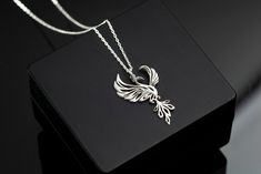 Phoenix Rising Necklace Sterling Silver, Phoenix Jewelry, Firebird Necklace, Bird Jewelry, Mythology Necklace, Inspirational Gift For Her TO OUR VALUED CUSTOMERS ! Please take a look at our special catalog that we have prepared for you ! ▶ https://www.etsy.com/shop/MarryMinimalist ✔️ All products in our unique store are personalized. ( You can find our font list in the images ) D E T A I L S ✔️A lifetime silver CLEANING CLOTH is given as a GIFT along with the 925 Sterling Silver Necklace! ✔️ * Made to Order. * Handmade with Sterling %100 925K Sterling Solid Silver. * Choice of Gold Color: Gold, Rose Gold, Silver * Length: 14", 16", 18", 20", 22" * Ready to Ship in 1-3 Business Days * Free returns within 14 days from the order date. ✔️ 24/7 Friendly Customer Service, contact us for any ques Phoenix Jewelry, Phoenix Necklace, Phoenix Pendant, Phoenix Rising, Bird Jewelry, Firebird, Necklace Sterling Silver, Pretty Jewellery, Love Gifts