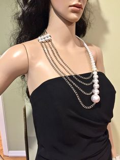 "This unusual, interesting, elegant, feminine, and classy pearl necklace has been designed and made by Mirela Skikic - USA. This complex necklace is made of white glass pearls on silver metal wire that can be adjusted to the position on your chest as you like. It closes with a silver color lobster clasp. It looks very elegant with any type of formal and casual outfit. It also can be a nice wedding accessory. It can be combined with other pieces from my \"Pearl Madness\" collection, which also ca Pearl Multi-strand Necklace For Parties, Long Pearl Pendant Necklace For Parties, Multi-strand Pearl Chain Necklace For Party, Pearl Beaded Necklace With Chain For Parties, Pearl Beaded Necklaces With Chain For Party, Long Pearl Necklace With Pearl Charm For Party, Long Pearl Necklace With Pearl Chain For Party, Long Pearl Necklace For Party, Long Pearl Chain Necklace For Party