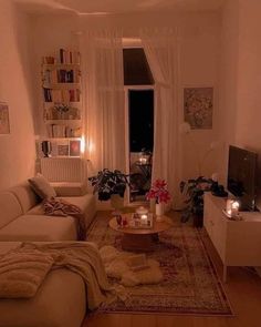 a living room filled with furniture and candles