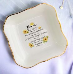 a white and gold plate with the words you are made for a purpose written on it