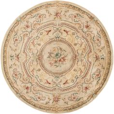 a round rug with an ornate design on the center and sides in beige, green, red