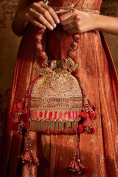 Red brocade potli bag with zardozi embroidery , crystal embellishments, chains tassels, tire cut and mongra wire.
Embroidered
Composition: Brocade
Color: Red
Tassel pull out drawchord
Chain tassels
Note: Wristlet shown in the image is not for sale - Aza Fashions Zardosi Embroidery, Zardozi Embroidery, Potli Bag, Potli Bags, Tarun Tahiliani, Red Handbag, Boho Bags, Beaded Clutch, Embroidered Bag