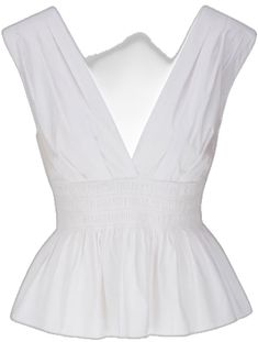 a white top with ruffles on the front and back, is shown in this image