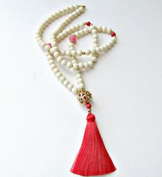 Long tassel necklace, Ivory beige glass beaded necklace, Pink tassel, Gold pendant with tassel, Summer necklace Bohemian ivory and pink glass beaded gold plated pendant and hot pink tassel A perfect necklace great for beachwear and layering * Beige glass beads * Gold metal beads * Large gold plated metal bead * Red pink tassel more necklaces https://www.etsy.com/shop/dadahandmade?section_id=14284001&ref=shopsection_leftnav_8 Thank you! Long Tassel Necklace, Beaded Tassel Necklace, Pink Tassel, Summer Necklace, Necklace Long, Beaded Tassels, Glass Bead Necklace, Pink Glass, Metal Beads