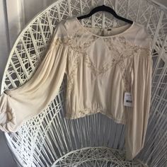 Free People Crop Round Neck Cream Blouse Xs Nwt. Never Worn. Gorgeous Crop Top With Balloon Sleeves . Beige Long Sleeve Tops With Blouson Sleeves, Feminine Beige Top With Lace Sleeves, Feminine Beige Tops With Lace Sleeves, Cropped Lace Top For Fall, Cream Long Sleeve Lace Top For Summer, Fall Beige Lace Top Blouse, Casual Blouse With Lace Sleeves For Brunch, Summer Beige Tops With Lace Sleeves, Chic Cropped Lace Top Blouse