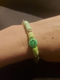 A cute but elegant green smiley bracelet, size for a small wrist from age 6 up to a very small adult woman. Handmade by Asty (age 10). Please support my shop! Adjustable Green Bracelets For Everyday, Everyday Adjustable Green Bracelets, Trendy Nickel-free Beaded Bracelets, Handmade Green Playful Friendship Bracelets, Fun Adjustable Nickel-free Bracelets, Handmade Green Friendship Bracelets Everyday, Handmade Green Friendship Bracelets For Everyday, Handmade Green Beaded Bracelets For Everyday, Handmade Green Bracelets For Everyday Wear