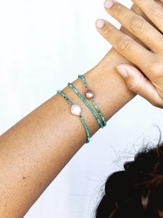 "A dainty jewelry design for appeasing the star within, this adjustable gold-filled bracelet comes beaded with tiny beads carved from all natural turquoise gemstone. ✦ DETAILS ✦ ✧ Name: Kalilinoe (kah lee lee noh eh) - rain. ✧ Adjustable Length from: 6.5\"-8\". ✧ Genuine 2.5mm faceted tiny Turquoise Beads. ✧ 14kt Gold Filled Components, Extender, and Clasp. ✧ All Ke Aloha Jewelry pieces come packaged thoughtfully, beautifully, and ready for gift giving. ✦ MORE GOLD BRACELETS ➤ https://www.etsy.c Adjustable Dainty Pearl Bracelet With Faceted Beads, Dainty Adjustable Pearl Bracelet With Faceted Beads, Adjustable Turquoise Gemstone Bracelets, Turquoise Bracelets With Faceted Beads For Gift, Adjustable Turquoise Gemstone Bracelet, Dainty Turquoise Gemstone Bracelets, Adjustable Turquoise Pearl Bracelet With Round Beads, Dainty Adjustable Turquoise Bracelet, Dainty Adjustable Turquoise Jewelry