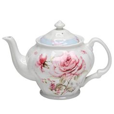 a white tea pot with pink roses painted on it