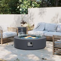 a fire pit sitting on top of a wooden deck