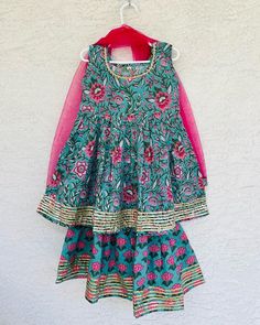 Girls Anarkali kurta in pure cotton hand block printed fabric. Gota/Embroidery/ Salwar/ Sharara with Gota work/ Net Dupatta with gota lace  Wash Care: Hand Wash Only. Fabric might shrink a little for the first wash. Festive Cotton Lehenga With Printed Motifs, Green Cotton Sharara For Festivals, Bollywood Style Cotton Sharara With Block Print, Bohemian Pink Cotton Anarkali Set, Pink Bohemian Cotton Anarkali Set, Chanderi Sharara For Festivals, Festive Cotton Sharara With Printed Motifs, Green Cotton Sharara For Navratri, Festive Cotton Block Print Sharara