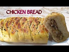 chicken bread cut in half on a white plate with the words chicken bread written above it