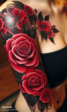 a woman's arm with red roses on it