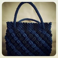 a crocheted blue bag is shown in this image, it looks like something from the movie