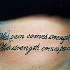 a woman's lower back tattoo with words written in cursive writing