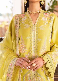 Yellow Pakistani Party Dress in Kameez Trouser Style has the perfect balance of ethnic and trendy look. This Pakistani Dress is adorned with lavish embroidery and floral designs and looks breathtaking when paired with organza dupatta. Detailed Description: SKU: PS2452 Detailing: Embroidery, Floral designs, Threads Color: Yellow Fabric: Organza, Lawn Design: Fully Embellished Dress with Embroidery Event: Bridal wear, Wedding Grey Pakistani Suit, Embroidery Floral Designs, Akbar Aslam, Lawn Design, Yellow Suit, Pakistani Party Wear, Patch Dress, Pakistani Lawn Suits, Pakistani Salwar Kameez