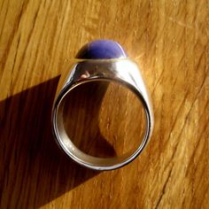 Like all of my men's rings, this has a rich, heavy weight and is solid underneath. The blue star sapphire is stunning. I make my pieces heirloom quality- built to last a lifetime. Custom handcrafted by me in my studio/workshop in Salt Lake City, Utah. You will love the weight, quality, look and feel of this ring. Stone: Finest quality, Stunning, Lab-grown Blue Star Sapphire. This lab-grown sapphire is structurally and chemically identical to a natural blue star sapphire. The only difference, rea Domed Sapphire Ring As A Gift, Blue Oval Cabochon Signet Ring With Polished Finish, Modern Sapphire Ring Oval Cabochon Polished Finish, Blue Domed Jewelry With Polished Finish, Modern Sapphire Ring With Oval Cabochon And Polished Finish, Classic Lapis Lazuli Ring With Polished Finish, Modernist Oval Signet Ring For Gift, Modernist Oval Signet Ring As Gift, Gift Sapphire Oval Cabochon Ring With Polished Finish