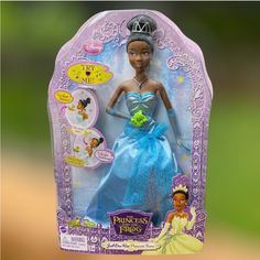 the princess and the frog doll is in its box