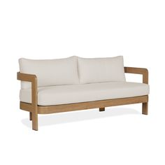 a white couch sitting on top of a wooden frame