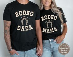 🤠 Giddy Up!! Celebrate your little one's first birthday in style with matching Rodeo birthday t-shirts for the whole family! These cute unisex Rodeo birthday tees are the perfect way to mark this special milestone in your child's life. Personalize the back side of the Birthday shirt for a special one-of-a kind shirt! Make a great gift!   If you want to add personalization to the Adult or sibling shirts add this listing to cart. https://www.etsy.com/listing/1320462357/add-on-custom-print-my-desi My First Rodeo Birthday Shirt, This Aint My First Rodeo Shirt, My First Rodeo Birthday Family Shirts, Black Custom Print T-shirt For First Birthday, This Ain’t My First Rodeo Svg, Black T-shirt With Custom Print For First Birthday, Black Graphic Print T-shirt For Rodeo, Family Birthday Shirts, Rodeo Birthday