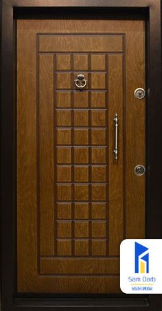 a wooden door with metal handles and glass panels on the front entrance to a building